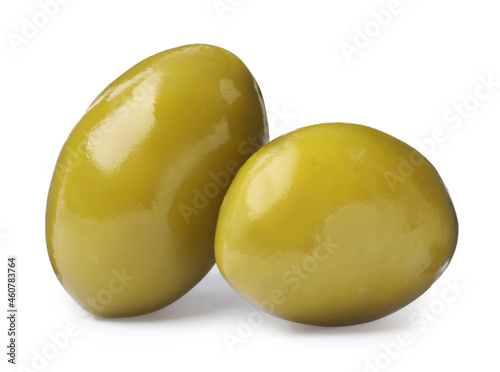 Two fresh green olives on white background