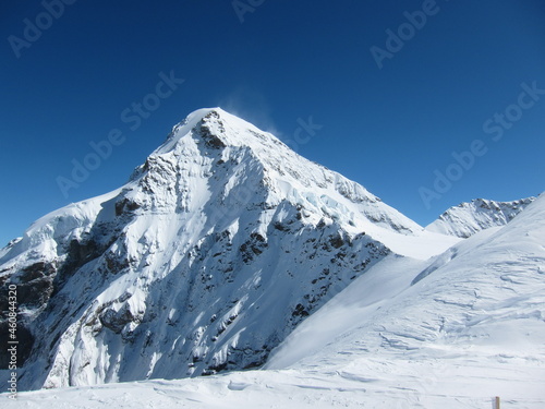 Amazing panoramic view of the mountain range with ice in the jungfrau alps