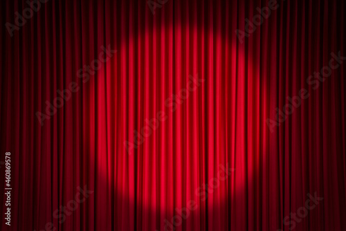 Red stage curtain with spotlight