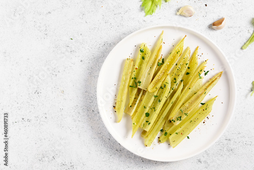 Braised celery on plate