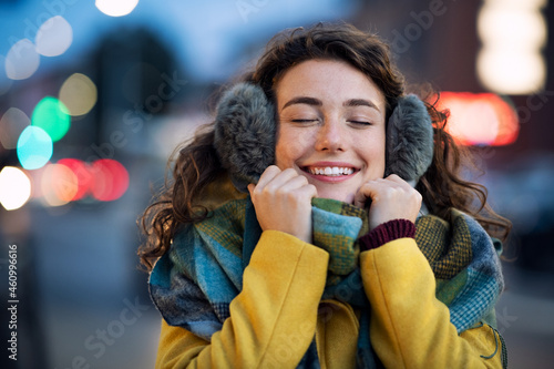 Woman enjoy warm clothes in winter evening