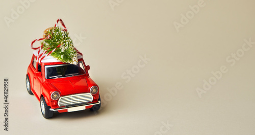 Little red toy car and Christmas tree