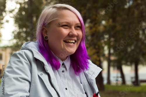 beautiful laughing lgbt woman colored hair portrait outdoor