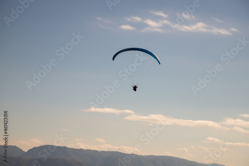 glider paragliding g against blue sky flying adrenaline and freedom concept