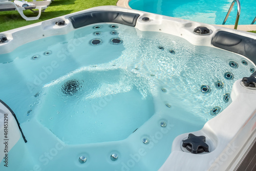 Luxury bathtub, jacuzzi for therapeutic massage and relaxation outside.