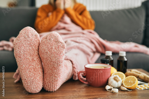 Woman with warm socks having a heavy flu