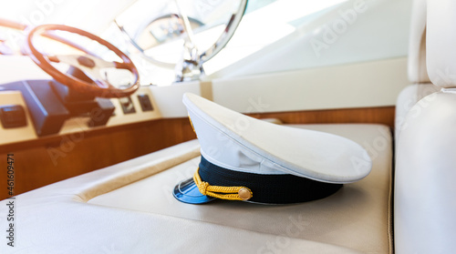 Rudder and captain's hat on yacht