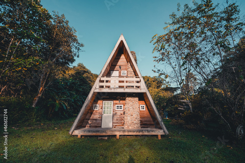 A-Frame cabin in summer morning