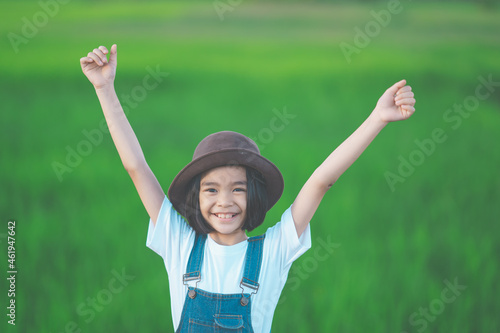 Happy children smile and posting on green nature background