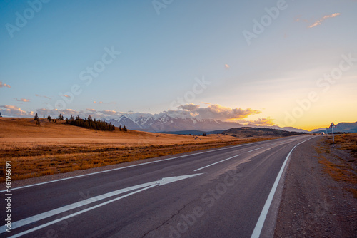 the road by the snowy mountains