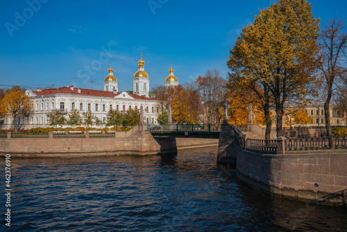 View of the Krasnogvardeysky Bridge over the Griboyedov Canal and the dome of the St. Nicholas Naval Cathedral on a sunny autumn day, St. Petersburg, Russia