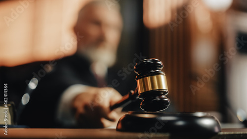 Court of Law and Justice Trial Session: Imparcial Honorable Judge Pronouncing Sentence, striking Gavel. Focus on Mallet, Hammer. Cinematic Shot of Dramatic Not Guilty Verdict. Close-up Shot.