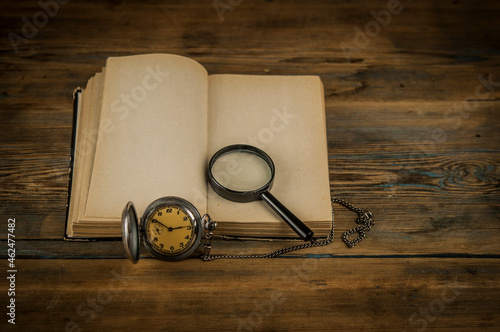 Old vintage books and a watch