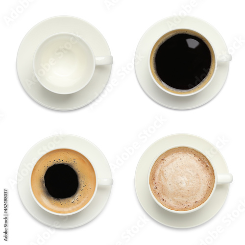 Set with cups of tasty aromatic coffee on white background, top view