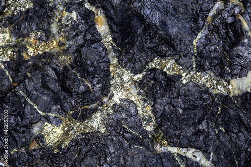 Golden Iron Pyrite (Fool's Gold), creating a veined pattern in a sample of black galena (lead ore.) From Chlorite, Arizona. 