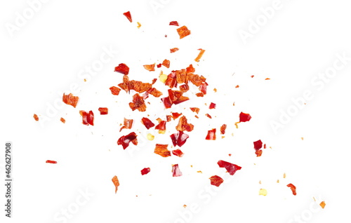 Crushed red cayenne pepper, dried chili flakes and seeds pile isolated on white background, top view