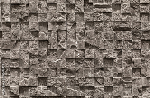 Wall background cement blocks stone base relief wall of various geometric shapes of natural stone