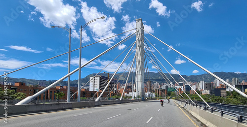 Medellin, Antioquia, Colombia. June 5, 2020: South avenue bridge and mountains and blue sky.