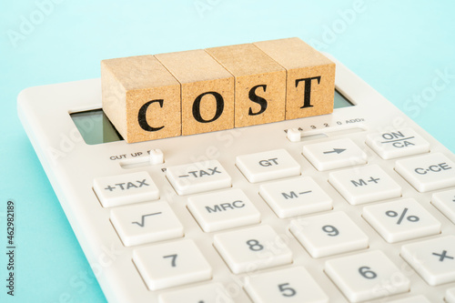 Concept of cost calculation (calculator and the word “COST”)