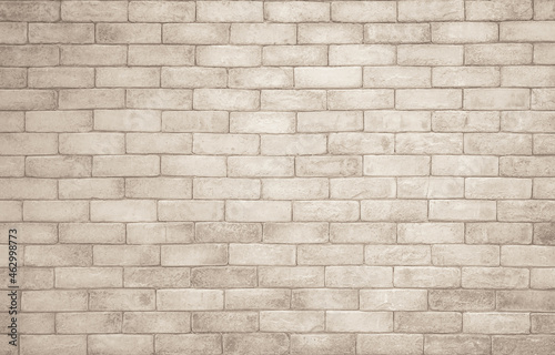 Cream and white brick wall texture background. Brickwork and stonework flooring interior rock old pattern clean concrete grid uneven bricks design stack. Background of old vintage brick wall