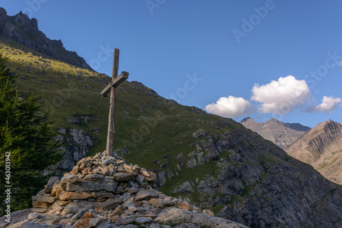 Wooden cross in the national park of the great paradise in the Alps, Italy, Aoste valley.