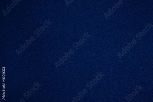 Dark blue background with decorative stucco design. Abstract navy blue and indigo blank template for ad, card, invitation, poster, wallpaper, website, etc.