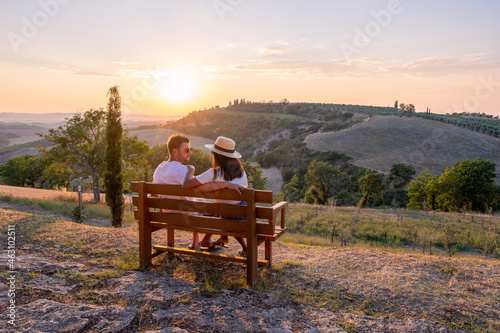 Tuscany Italy, Perfect Road Avenue through cypress trees ideal Tuscan landscape Italy, couple man and woman on vacation in Toscane, couple man and woman in the hills of Toscany