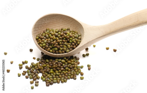 Green mungo beans in wooden spoon (Vigna radiata) isolated on white background 