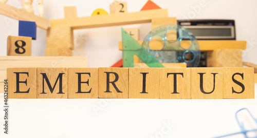 The word Emeritus was created from wooden cubes. Education and career concept.