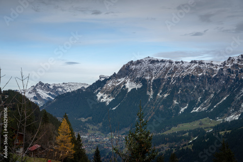 Mannlichen Mountain in the Bernese Alps stays above Wengen Village - Murren, Switzerland