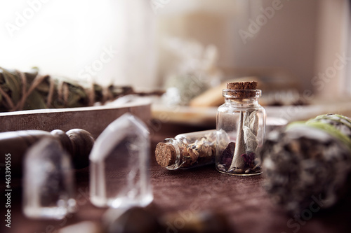 Detail of two glass jars with some medicinal herbs on an altar to perform esoteric rituals