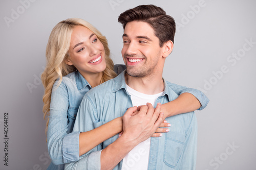Photo of young couple happy positive smile embrace love feelings spouses isolated over grey color background