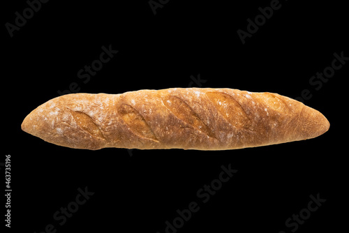 French freshly baked baguette isolated on black background , top view