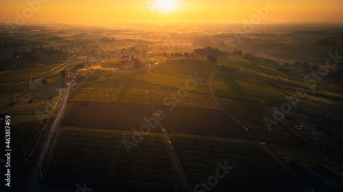 Aerial view of villefranche sur Soane capital of Beaujolais viticulture for France wine production, hills countryside vineyard during sunset