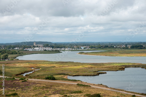 view of Christchurch Priory from Hengistbury Head Dorset England