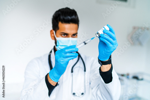 Coronavirus vaccine, injection, the doctor is preparing to vaccinate the patient