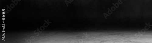 Panorama of concrete wall and floor with spot light and shadow backgrounds, dark room, use for product display for presentation and cover banner design.