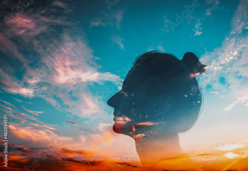 mindfulness and mental health concept double exposure of woman head and sunset sky