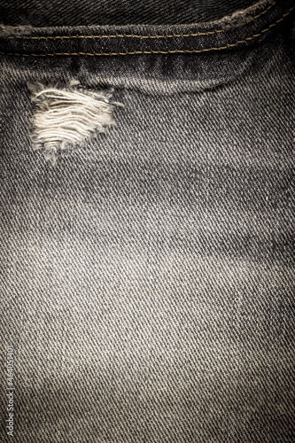 Vintage torn denim jeans texture.