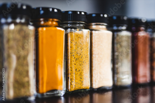 spices seeds and seasonings in mathing spice jars on tidy pantry shelf, simple vegan ingredients and flavoring your dishes