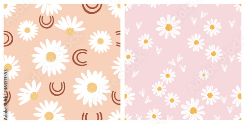 Seamless patterns with cute hand drawn daisy flower on pastel pink and orange backgrounds vector illustration. 