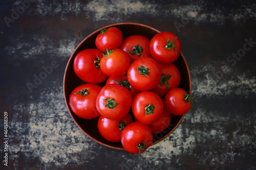 Fresh juicy tomatoes in a bowl.