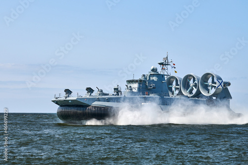 Landing Craft Air Cushion hovercraft flying above water, air cushion sailing splashing sea water