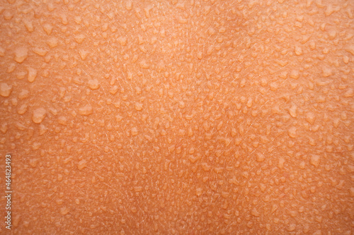 Water or sweat drops on human skin. Wet skin