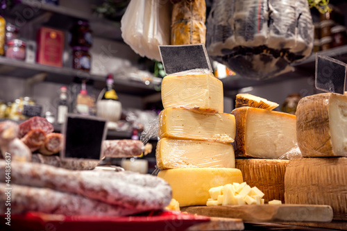 Italian food market with cheese and pepperoni, formaggio crociato fresco, Tuscan delicatessen stall display, Florence, Italy