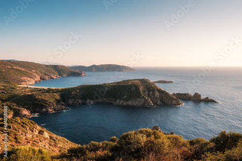 Evening sunshine on Punta di Rizaghiu and Plage d'Arone beach and the rugged west coast of Corsica