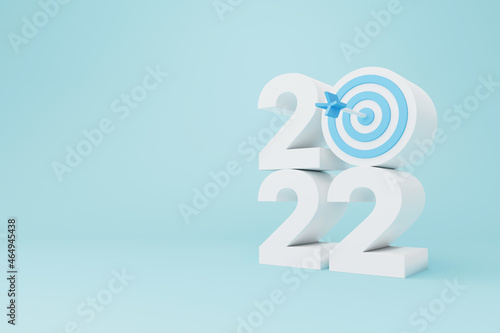 New year resolution 2022. Goal achievement. Ambition aiming success. Dartboard and arrow with number. 3d rendering illustration