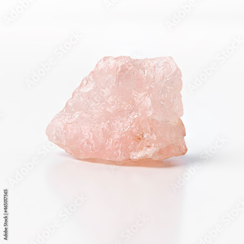 Rose quartz raw silicon dioxide mineral isolated on white background
