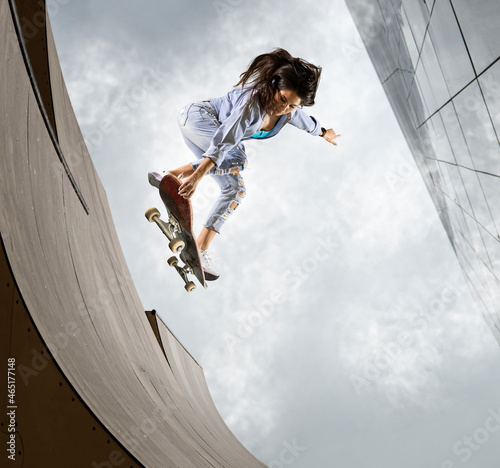 Skater doing kickflip on the ramp