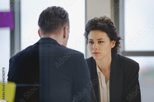 Caucasian business professional woman seriously listen to senior boss explaining job assignment of team communication consultant and cooperation negotiation